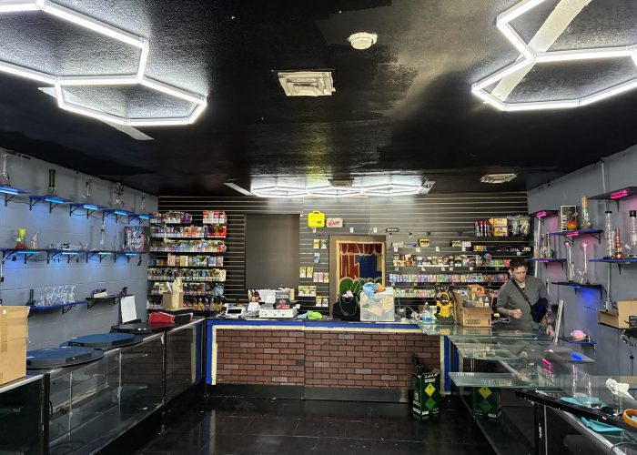 Fully stocked retail smoke shop counter and shelves