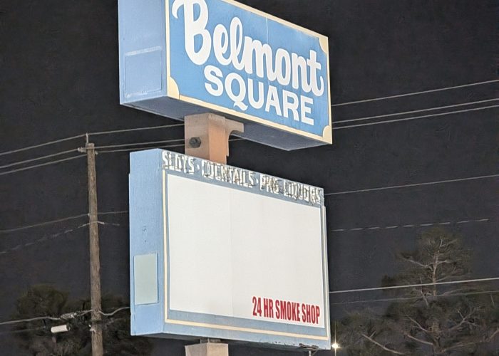 Illuminated Belmont Square retail plaza sign at night